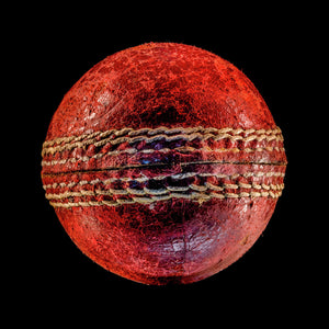 Cricket ball on black background print 